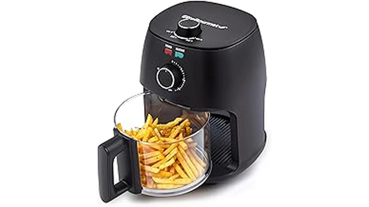 The image shows a sleek, modern air fryer on a countertop, representing top-rated options for single individuals.